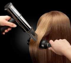 Person using a DIVA Atmos 2 Ultra Atom Professional Hairdryer on their hair 